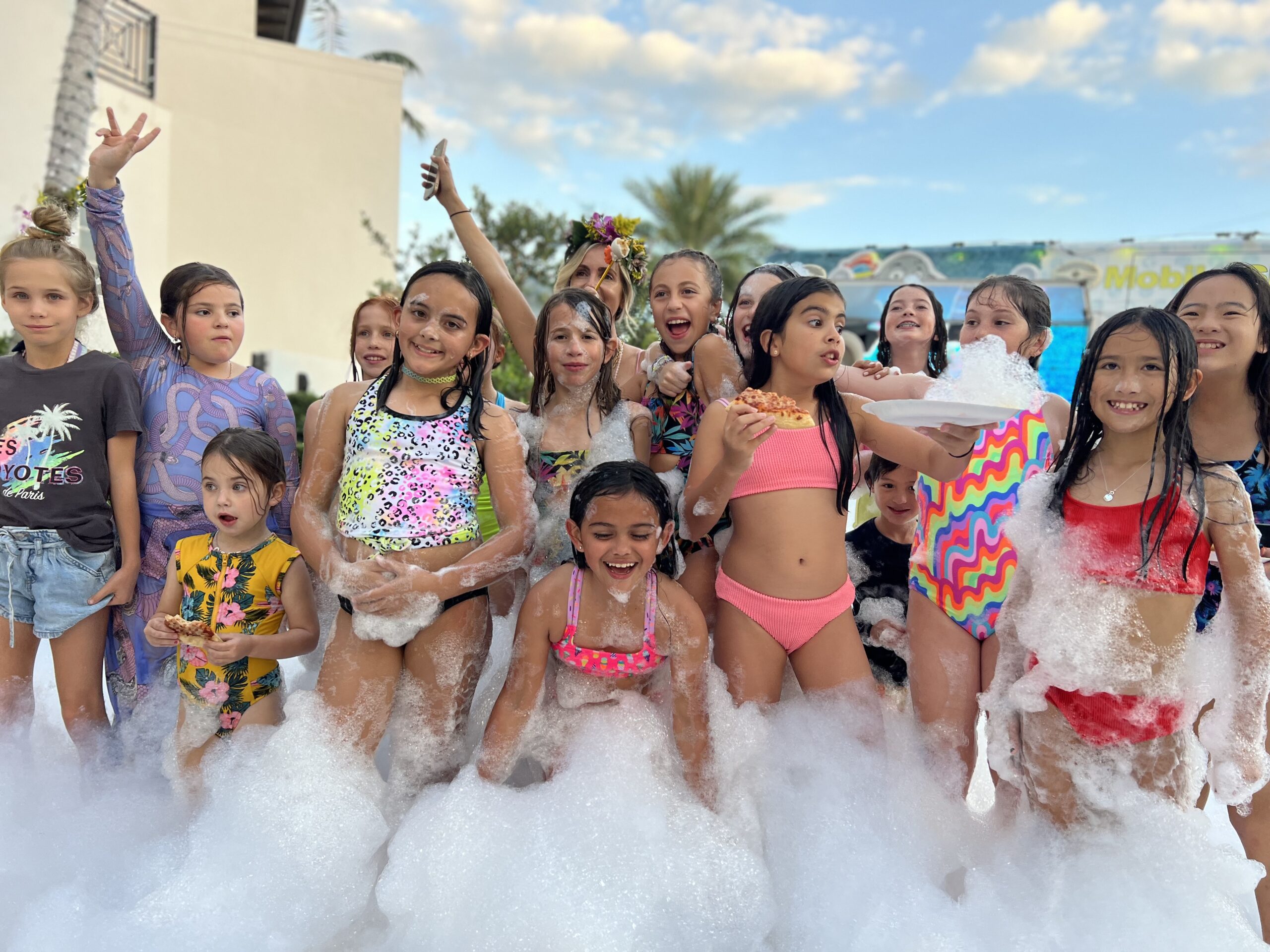group picture of kids in foam party