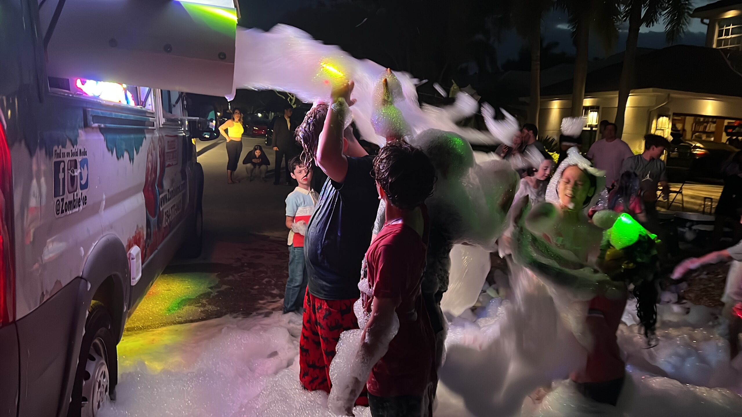 kids playing near the foam machine rental