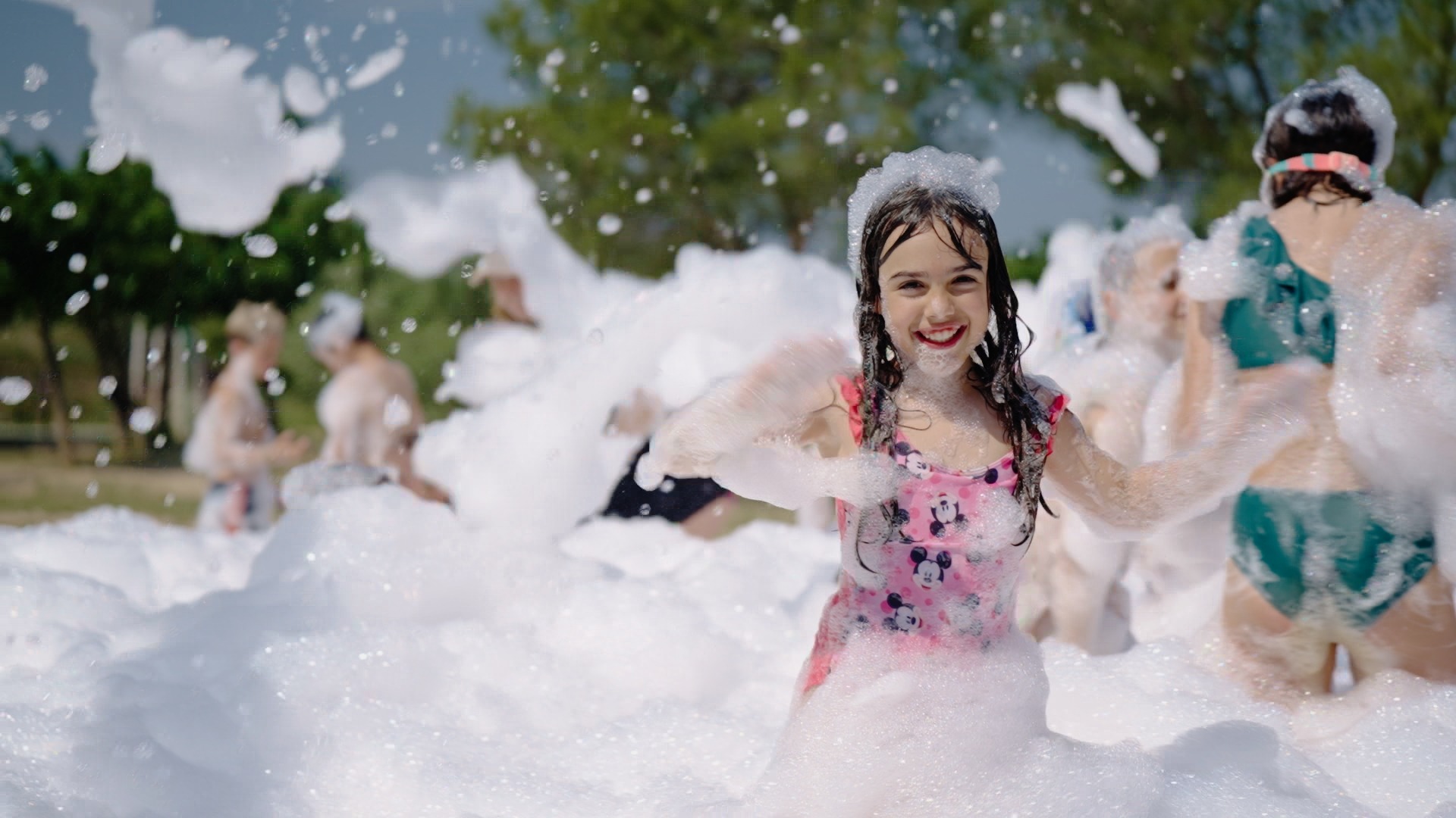 Kids playing in foam at a Zombie Truck Foam Experience party