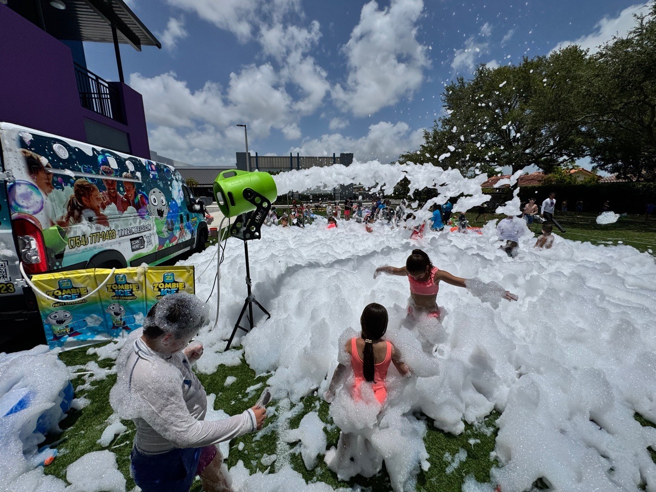 Zombie Ice foam cannon firing over a field at a Zombie Truck Foam Experience party